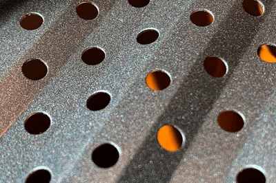 Dark bronze perforated aluminum gutter guard panel